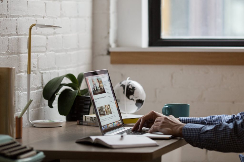 Business owner typing on a computer