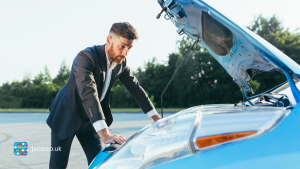 Man looking in bonnet symbolising looking under the bonnet of his small business